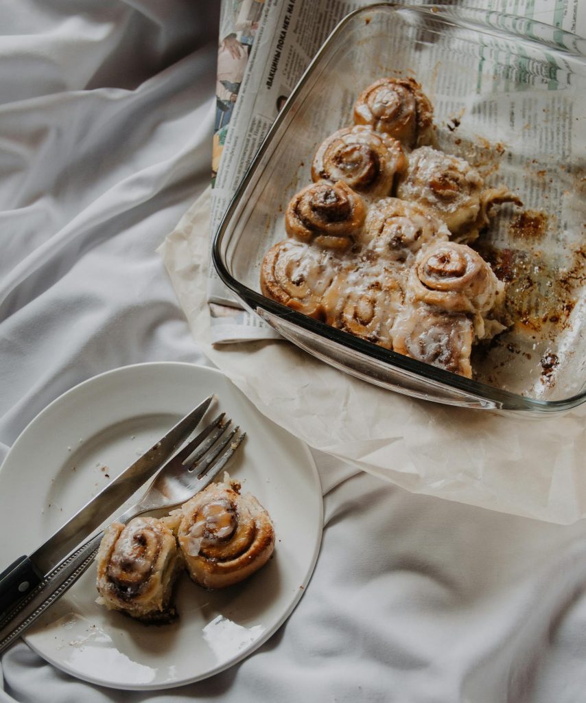 Freshly baked cinnamon rolls with icing, perfect for an indulgent breakfast treat.